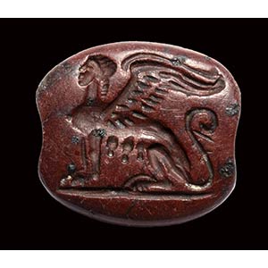 An archaic greek red jasper engraved seal. ... 