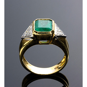 An Emerald & Diamond Ring ; ; One 18K gold ... 