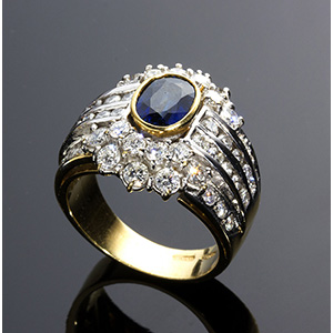 A Blue Sapphire and Diamonds Ring; ; An 18K ... 
