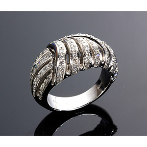 An 18K gold diamonds band ring, weighing in ... 