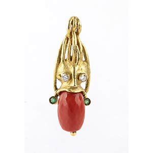 18k yellow gold pendant depicting a mask, ... 