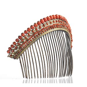 A coral comb tiara decorated with red ... 