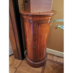 Bedside table column-shaped with front door. ... 