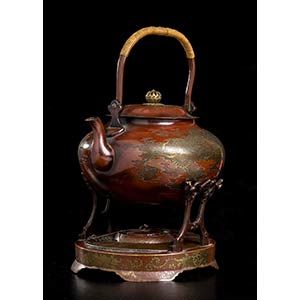 AN ENAMELED AND GILT METAL TEAPOT WITH LID, ... 