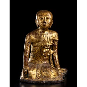 A LACQUERED AND GILT WOOD SCULPTURE OF A ... 