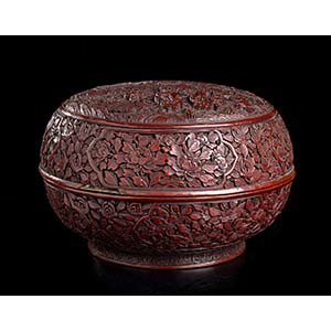 A CARVED RED LACQUER CIRCULAR BOX AND ... 