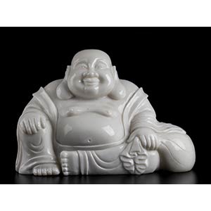 White jade carving
depicting a Buddha. ... 
