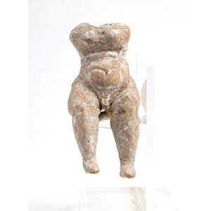 Greek terracotta seated Putto; ... 