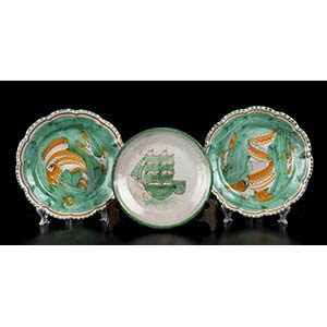 CASThree green plates with fishes and ... 