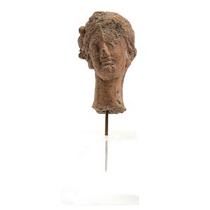 Greek terracotta head of a woman with floral ... 