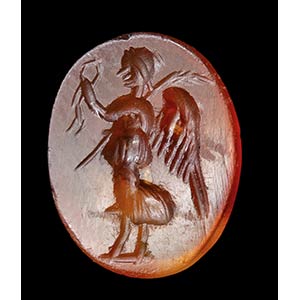 A roman agate carnelian intaglio. Winged ... 