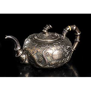 A SILVER TEAPOT
China, Qing dynasty, dated ... 