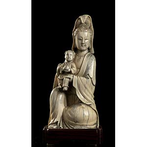 AN IVORY GUANYIN WITH CHILD
China, Qing ... 