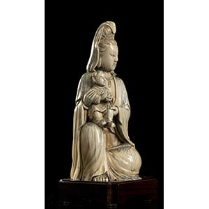 AN IVORY GUANYIN WITH ... 