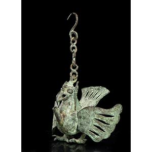A BRONZE OIL LAMP IN THE SHAPE OF ... 