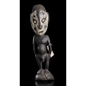 A WOOD AND COWRIE-SHELLS ANTHROPOMORPHIC ... 