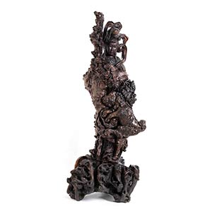 A LARGE ROOT CARVING OF A GUANYIN
China, ... 