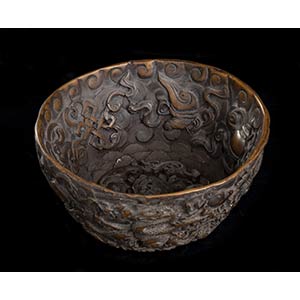 A CARVED DRAGON BOWL
China, ... 