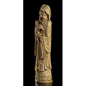 AN IVORY DEITY WITH CHILD
China, ... 