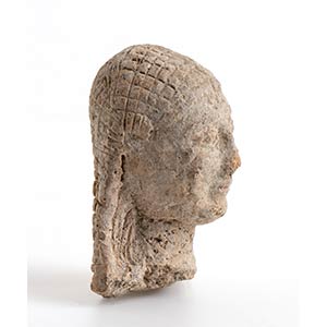 Greek terracotta head of a Kore; ... 