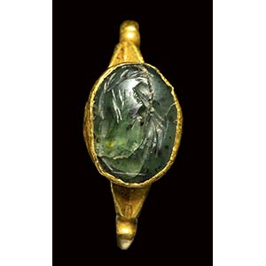 A roman green chalcedony intaglio mounted in ... 