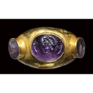 A large roman gold ring set with three ... 