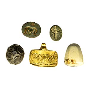 A group of 5 engraved stones and a gold ... 