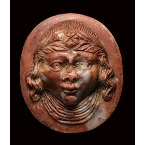 A north italian medieval red marble cameo. ... 