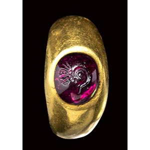 A roman gold ring set with a garnet cabochon ... 