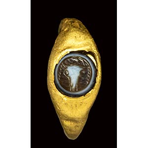 A roman gold ring set with a three-layered ... 