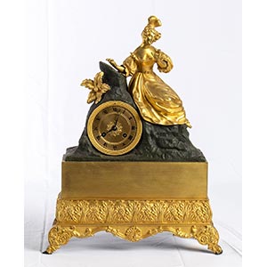 French gilt bronze table clock depicting a ... 