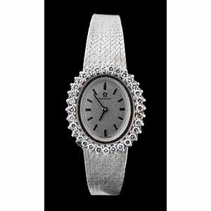 OMEGA: gold and diamond Ladys wristwatch ... 