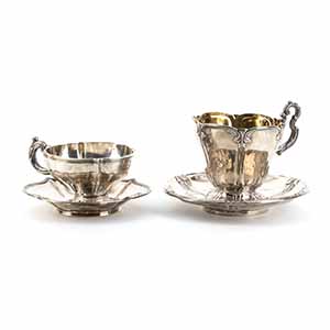 Two French silver cups with plates ... 