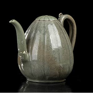 AN INCISED AND CÉLADON GLAZED CERAMIC EWER ... 
