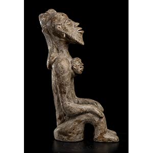 A POTTERY FIGURE Africa28 x 21 ... 