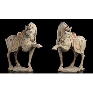A PAIR OF PARTIALLY PAINTED CERAMIC HORSES  ... 