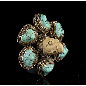 A STONE AND TURQUOISE INLAID METAL ... 