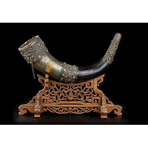 A STONE INLAID HORN AND METAL ... 