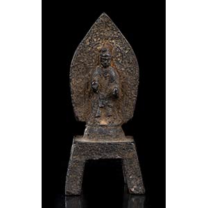A SMALL BRONZE STELE WITH A STANDING  BUDDHA ... 