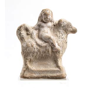 Greek terracotta Statuette: boy seated on a ... 