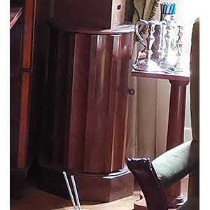 Bedside table  cylindrical with door.