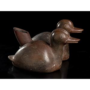 A POTTERY EWER SHAPED AS TWO DUCKS ... 
