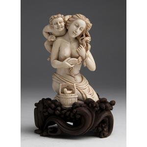 A carved ivory figural group depicting a ... 