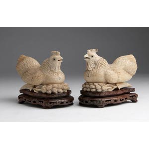 A pair of carved ivory opium boxes depicting ... 