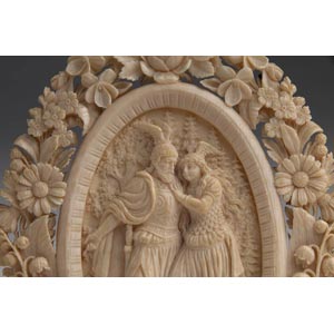 A carved ivory frame with ... 