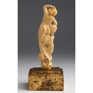 A carved ivory nude female figure ... 
