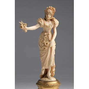 A carved ivory figure of a lady - ... 