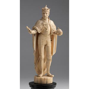 A carved ivory figure of an ... 