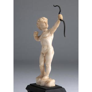 “Cupid”. A carved ivory figure ... 