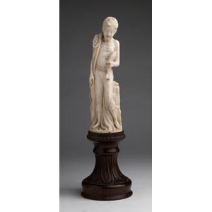 A carved ivory figure of a fisherman, G. ... 